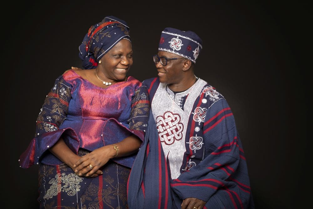 Couple wearing traditional cultural clothing photographed together during a family photoshoot in Birmingham