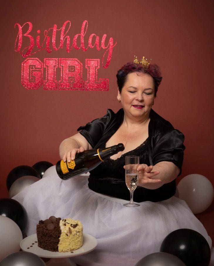 adult cake smash birthday photoshoot in Birmingham studio with champagne and celebration cake