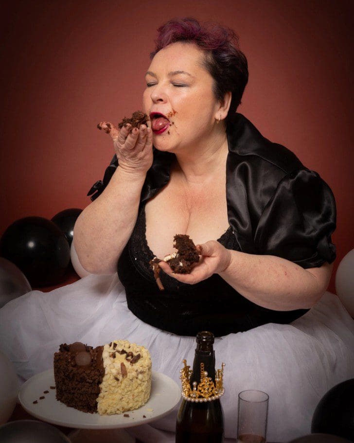 adult cake smash birthday photoshoot in Birmingham studio with messy cake and balloons
