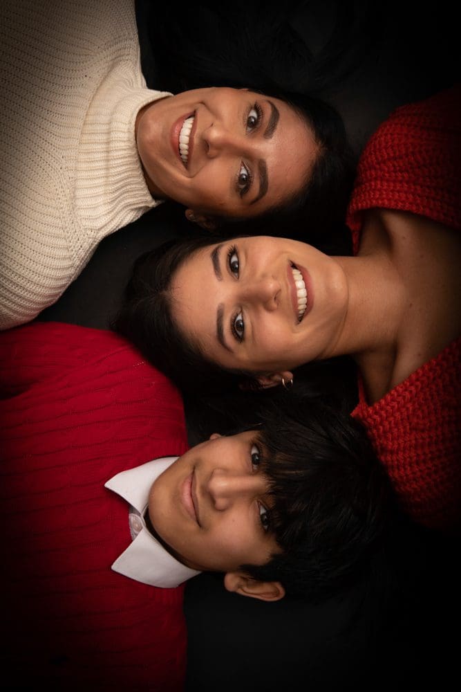 parent and child smiling together during studio family photoshoot in Birmingham
