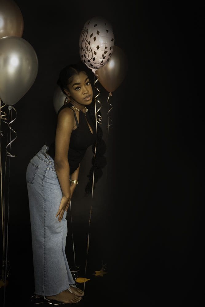 adult birthday studio photoshoot in Birmingham with balloons and casual pose