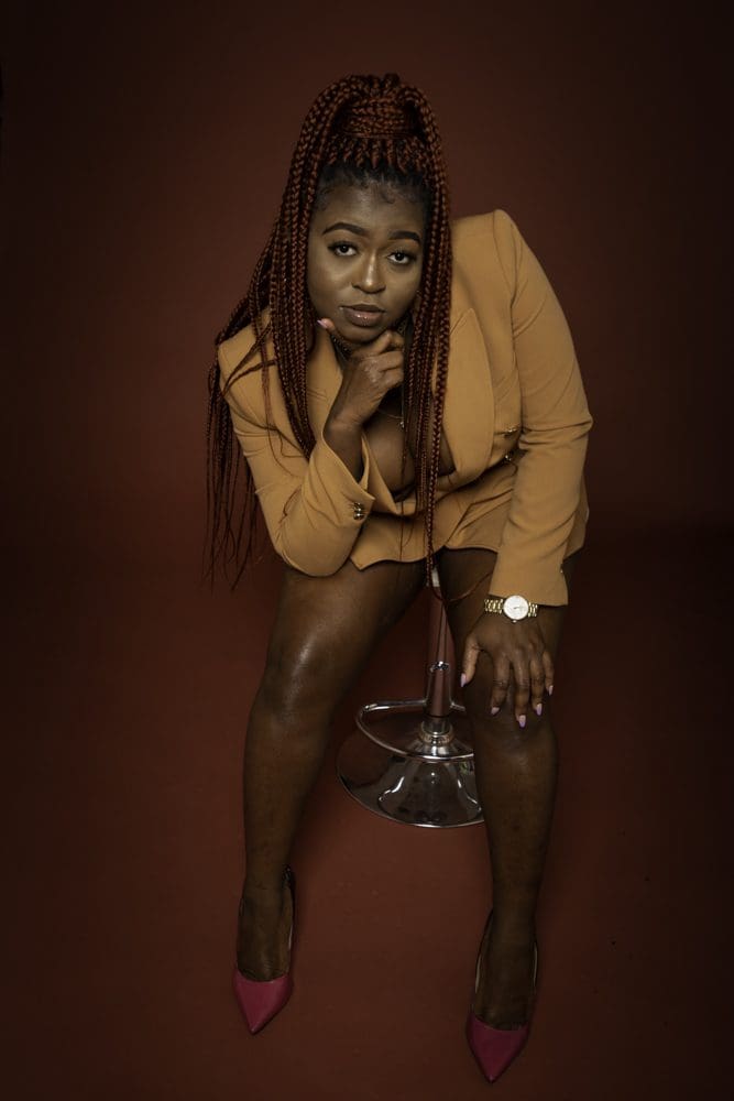 adult birthday studio photoshoot in Birmingham with confident seated portrait