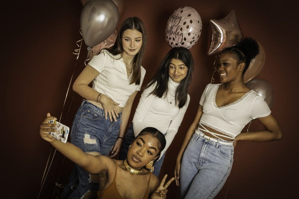 adult studio birthday photoshoot in Birmingham with group of friends and balloons