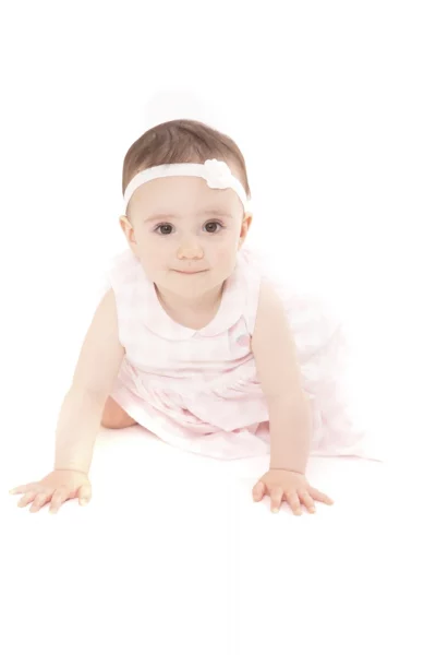 Adorable baby lying down during a professional baby photoshoot in Birmingham by an experienced newborn and baby photographer.