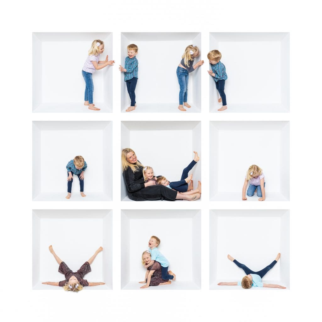 Inside the box photography of children and siblings playing together inside a white studio box.