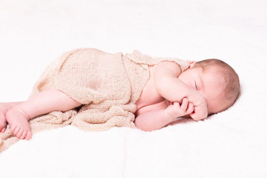 sleeping newborn baby portrait in Birmingham photography studio on white background