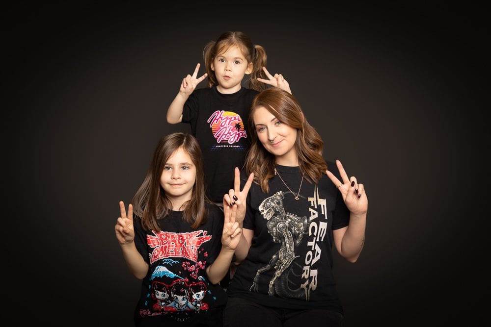 mother and two children posing together during studio family photoshoot Birmingham